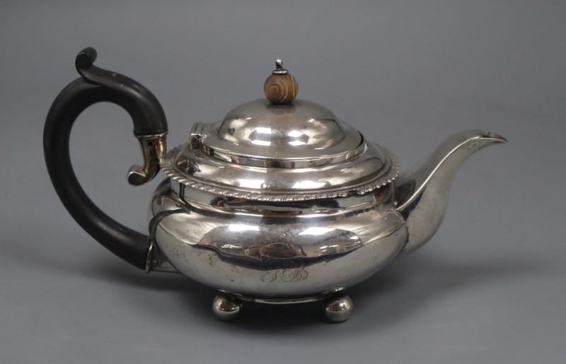 A George IV silver squat teapot by Pearce & Burrows, London, 1827, gross 12.5 oz.